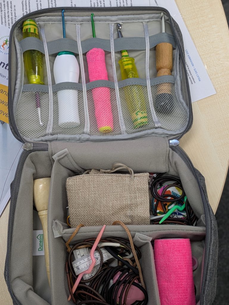 A carry case containing Clair's adapted hooks
